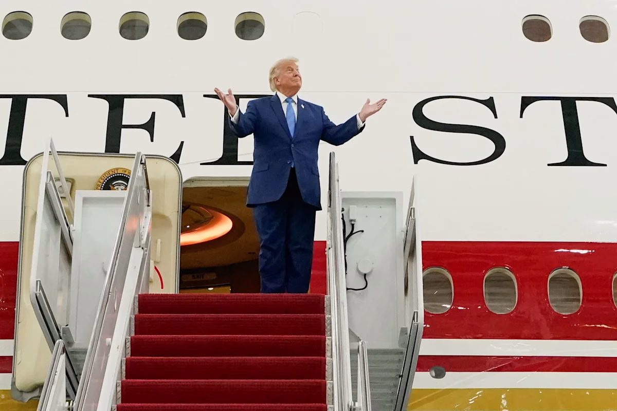 President Donald Trump gestures as he tours the VC 25B aircraft gifted by Qatar that will be used as Air Force One at Joint Base Andrews Maryland U.S. June 19 2026